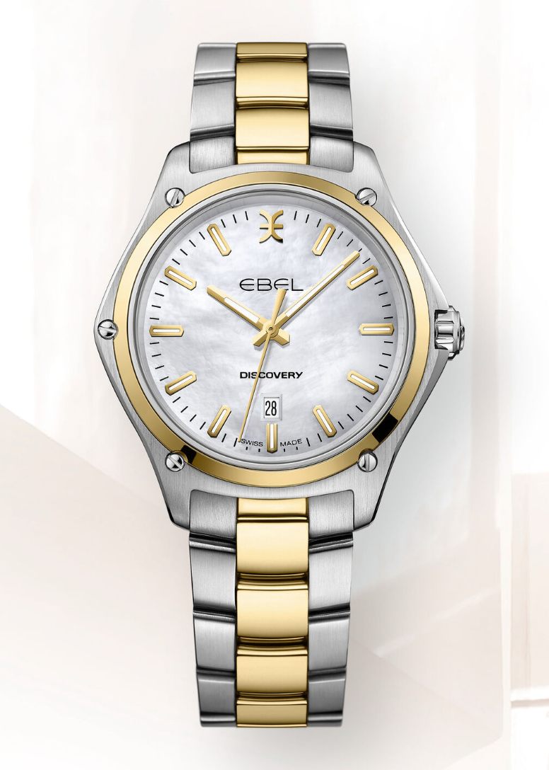 EBEL Discovery - 1216549 dames polshorloge. Edelstalen kast gecombineerd met 18 karaat geel goud. Ø 33 mm. Witte parelmoeren index wijzerplaat met datum aanduiding op 6 uur. Saffier glas. Edelstalen Link band met goud accenten en klap sluiting. Zwitsers quartz uurwerk. 10 ATM waterdicht.